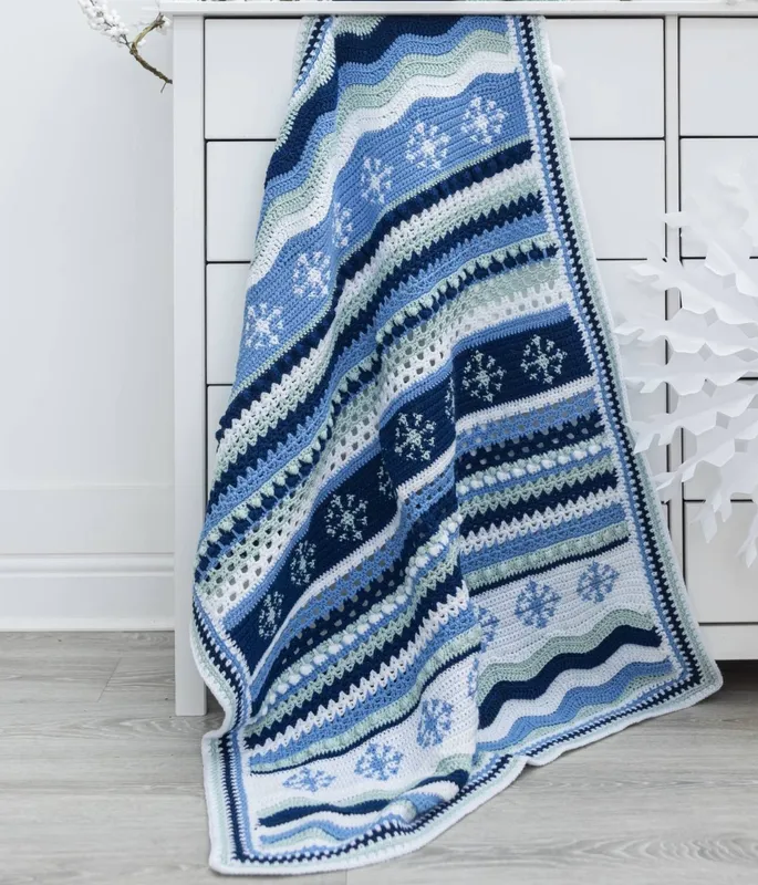 The Snowflake Crochet Blanket Kit in EMU Classic DK Frosty Blue 8x100g